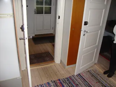 an open door leading to a room with a hallway at Klosterpensionen Annex in Viborg