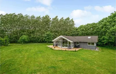 a small house with a large yard at Holiday Home Vemb With Fireplace 07 in Vemb