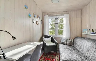 a room with a couch and a table and a window at Holiday Home Frøstrup With Fireplace 10 in Frøstrup