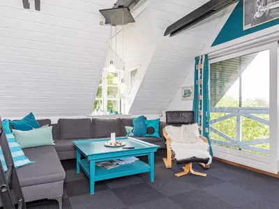 a living room with a couch and a table at 19 person holiday home in Løgstør-By Traum in Trend