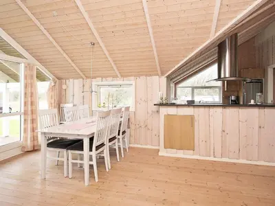 a kitchen and dining room with a table and chairs at 6 person holiday home in Vestervig-By Traum in Vestervig