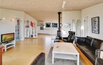 a living room with a couch and a table at Awesome Home In Vinderup With Wifi in Vinderup