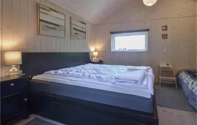 a bedroom with a large bed in a room at Three-Bedroom Holiday Home In Spottrup in Spottrup