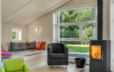 a living room with a couch and a window at Two-Bedroom Holiday Home In Logstor in Løgstør