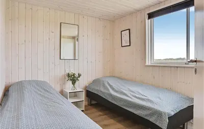 a bedroom with two beds and a window at Seven-Bedroom Holiday Home In Spottrup in Spottrup