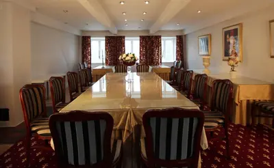 a conference room with a long table and chairs at Store Restrup Manor House in Store Restrup