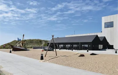 a playground in front of a building with a building at One-Bedroom Holiday Home In Ulfborg in Ulfborg