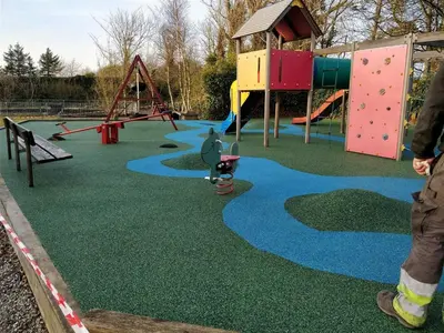 a man standing in front of a playground at Myrhoj Camping in Myrhøj