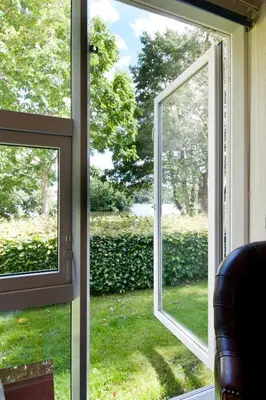 an open window with a view of a yard at Golf Hotel Viborg in Viborg