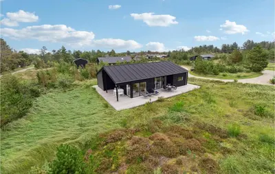 an overhead view of a black house in a field at Three-Bedroom Holiday Home In Fjerritslev in Fjerritslev