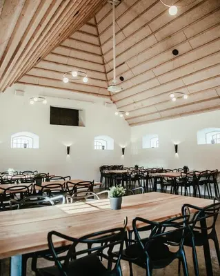 a large room with tables and chairs in it at Sebber Kloster in Nibe