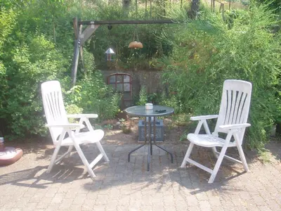 a table and two chairs and a table and a table and chairs at Glyngøre Bed & Breakfast in Glyngøre