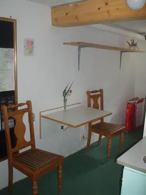 a table and two chairs in a room at Glyngøre Bed & Breakfast in Glyngøre