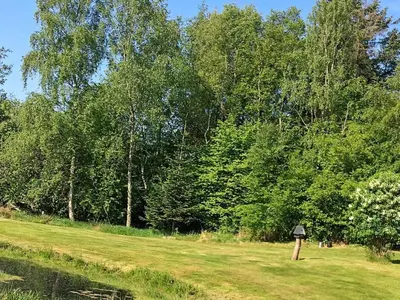 a bird sanctuary in a field next to a lake at 5 person holiday home in Fur-By Traum in Fur
