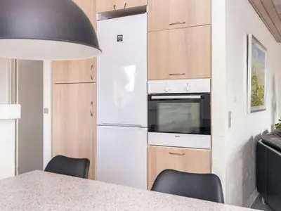 a kitchen with a counter top and a stove top oven at 12 person holiday home in Harboøre-By Traum in Harboør