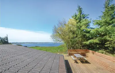 a bench sitting on top of a roof at Three-Bedroom Holiday Home In Struer in Struer