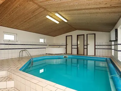 a large swimming pool in a room with at 10 person holiday home in Harboøre-By Traum in Harboør