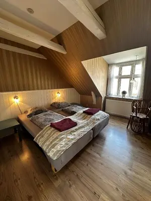 a bedroom with two beds in a attic at Oasen in Viborg