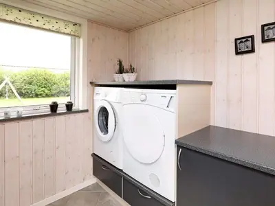 a washing machine in a kitchen with a window at 8 person holiday home in Fjerritslev in Fjerritslev