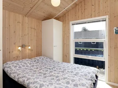 a bedroom with a bed and a window at Luxury Retreat in Vorupor - By Traum Ferienwohnungen in Nørre Vorupør