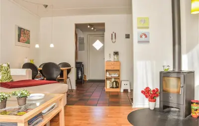 a living room with a couch and a table at 2 Bedroom Lovely Apartment In Lemvig in Lemvig
