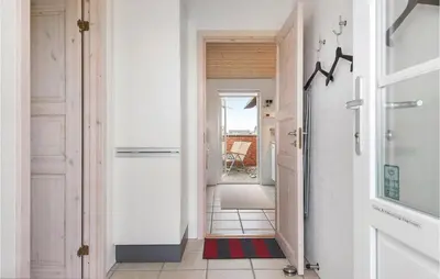 a hallway with a door leading into a room at Three-Bedroom Holiday Home In Harboore in Harboør