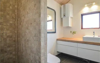 a bathroom with a shower and a sink at Five-Bedroom Holiday Home In Lokken in Løkken