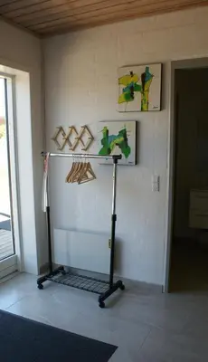 a treadmill in a room with paintings on the wall at Hyggeligt byhus ved glasværkstedet på Nordmors in Sejerslev