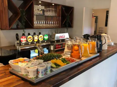 a buffet with a tray of food and drinks on a counter at Thyborøn Hotel in Thyborøn