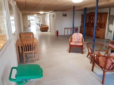 a room with chairs and a table and chairs at Kyndestoft Bed & Breakfast in Holstebro