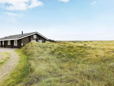 a house on the side of a grassy hill at 10 person holiday home in Frøstrup-By Traum in Frøstrup