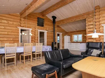 a living room with a table and chairs at 10 person holiday home in Frøstrup-By Traum in Frøstrup