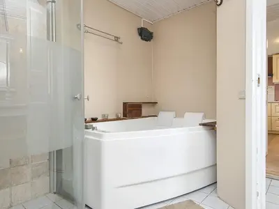 a white tub in a bathroom with a shower at 6 person holiday home in Harboøre-By Traum in Harboør