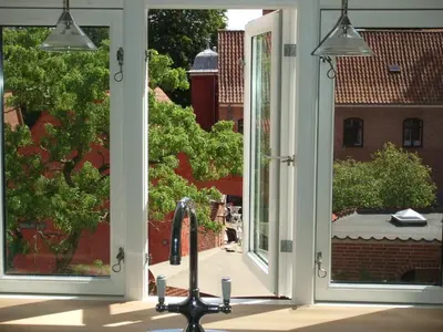a view from the inside of a house with two windows at Nattely I Viborg By in Viborg