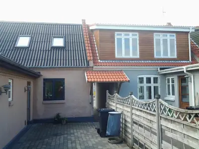 a house with a fence in front of it at 
