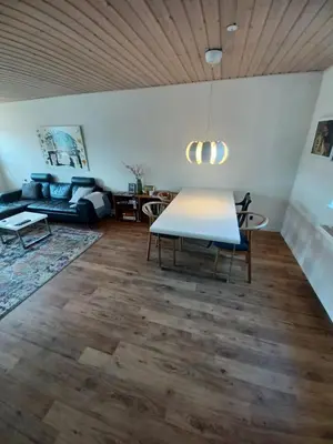 a living room with a table and a couch at 