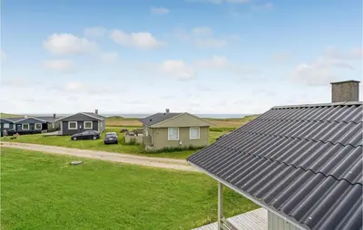 a view of a row of houses and a yard at Three-Bedroom Holiday Home In Lemvig in Lemvig