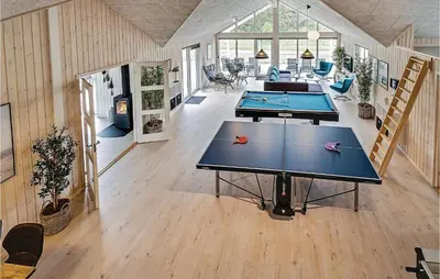 a large room with two ping pong tables in it at Nice Home In Spøttrup With Sauna in Spottrup