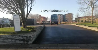 a driveway with a sign on the side of a road at Bed and Breakfast i Struer in Struer