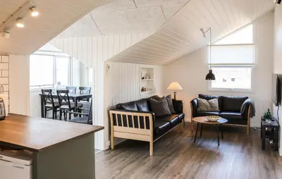 a living room with a couch and a table at Two-Bedroom Holiday Home In Lemvig in Lemvig