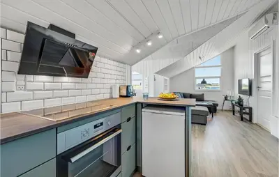 a kitchen with a sink and a counter top at Two-Bedroom Holiday Home In Lemvig in Lemvig