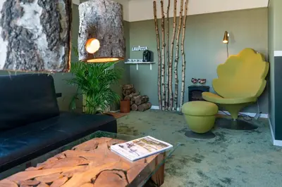 a living room with a couch and a table at Klitmøller Hotel in Klitmøller