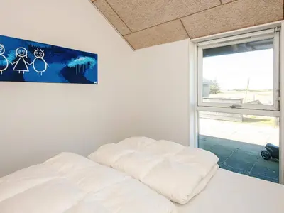 a white bed in a room with a window at Luxury Retreat in Vorupor - By Traum Ferienwohnungen in Snedsted