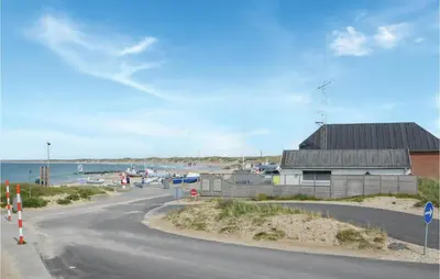 a winding road next to a marina with a building at Two-Bedroom Apartment In Thisted in Thisted
