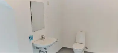 a bathroom with a sink and a toilet at Feriehus Thy - I hjertet af Thy in Thisted