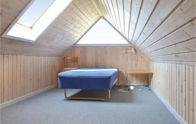 a room with a bed and a skylight at 3 Bedroom Awesome Home In Thisted in Thisted
