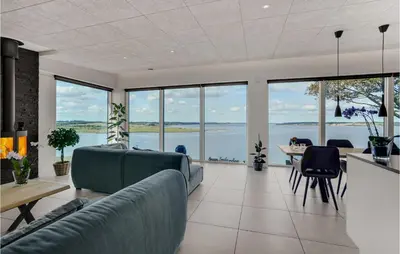 a living room with a couch and a table at Amazing Home In Løgstrup With Wifi in Løgstrup