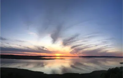 a sunset over a large body of water at Amazing Home In Løgstrup With Wifi in Løgstrup