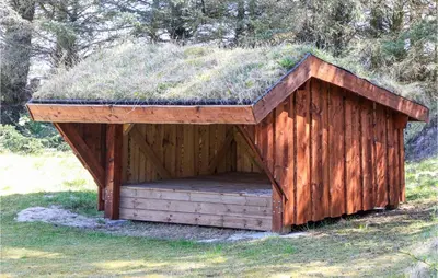 a smallshed with a grass roof on a field at 4 Bedroom Beautiful Home In Saltum in Saltum