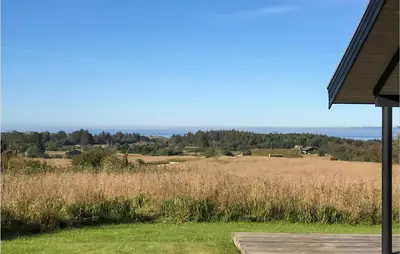a view of a field from a house at Beautiful Home In Blokhus With Kitchen in Blokhus